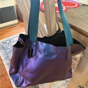 Coach leather Iridescent metallic purple hobo tote bag with magnetic closing.